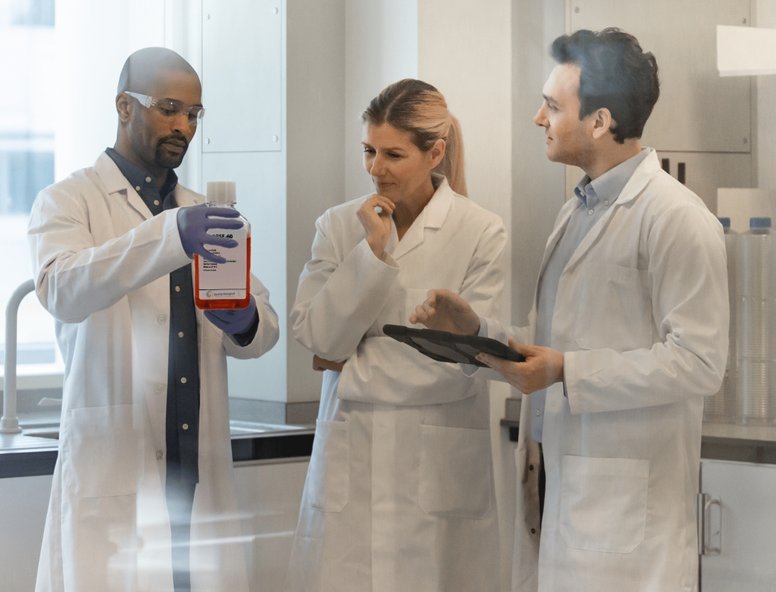 Scientists with customized cell culture medium